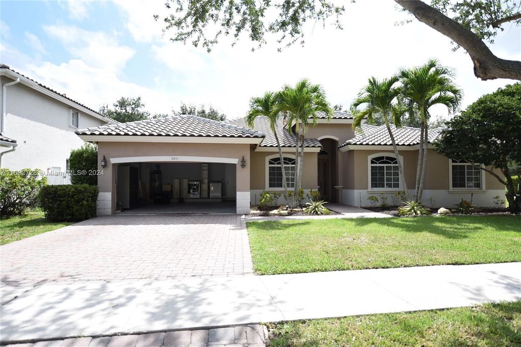 Photo of 2841 Poinciana Cir #2841, Cooper City, FL 33026 (MLS # A11602728)