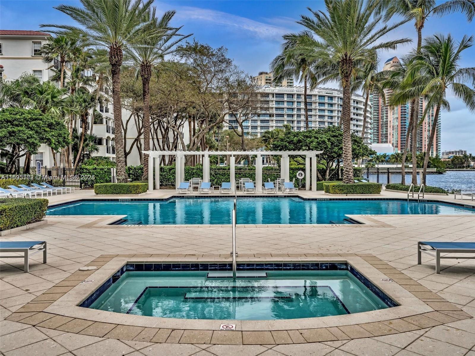 Live in this beautiful 2 bed/2bath unit in Village by the bay. Located in a waterfront, gated community with spectacular amenities, including 2 sunrise and sunset pools, gym, jacuzzi, 2 tennis courts, BBQ area, yoga room, clubhouse with theater, dog park and more. Unit has been freshly painted, new carpet in the bedrooms, washer/dryer inside the unit, and features a spacious quiet balcony with a garden view. One assigned parking space conveniently located on the same floor as the unit, plenty of guest parking available. Prime location 5 minutes to Sunny Isles Beach, Aventura mall, and within walking distance to supermarkets and restaurants. Minimum 31 days rental.