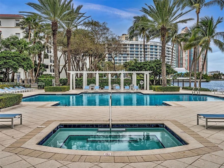 Live in this beautiful 2 bed/2bath unit in Village by the bay. Located in a waterfront, gated community with spectacular amenities, including 2 sunrise and sunset pools, gym, jacuzzi, 2 tennis courts, BBQ area, yoga room, clubhouse with theater, dog park and more.  Unit has been freshly painted, new carpet in the bedrooms, washer/dryer inside the unit, and features a spacious quiet balcony with a garden view. One assigned parking space conveniently located on the same floor as the unit, plenty of guest parking available. Prime location 5 minutes to Sunny Isles Beach, Aventura mall, and within walking distance to supermarkets and restaurants. Minimum 31 days rental.