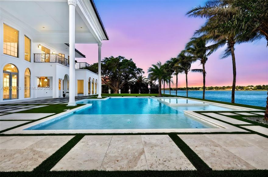 ATTENTION BUYERS: MAJOR PRICE IMPROVEMENT! Move-in ready and totally remodeled luxury home at Davie. This magnificent lakefront retreat boasts 9,234 sqft of living area & sits on a 36,850 sqft lot overlooking the water. Double-height ceilings, spectacular chandeliers & mesmerizing water views welcome you as soon as you walk in. Home was fully redesigned & crafted with precision, every detail was hand selected & it shows. Brand new 2025 Roof. On the first level enjoy an exquisite chef's kitchen with double islands, top of the line appliances & a striking cascade hood. Also a separate dining area & bar perfect for gatherings, and a theater room for endless entertainment. LED lighting on walls giving it a modern touch. Beautiful iron cast staircase takes you to the 2nd level or you can use the elevator. The master bedroom is everyone's dream, it's a whole wing of almost 1,000 sqft featuring a bar with sink, separate seating area, French doors leading to the huge balcony overlooking the pool & lake area, and his & hers separate full baths each with its beautiful custom closet. The backyard is a showstopper with a unique pool & jacuzzi, covered area with a summer kitchen, turf and lots green areas for outdoor activities, designed for simple maintenance so you can spend time enjoying it with the most relaxing view. Car lovers will love the 3 car garage, circular paved driveway & separate driveway on the side for extra space. Home feels grand, private & exclusive! Ready to close!