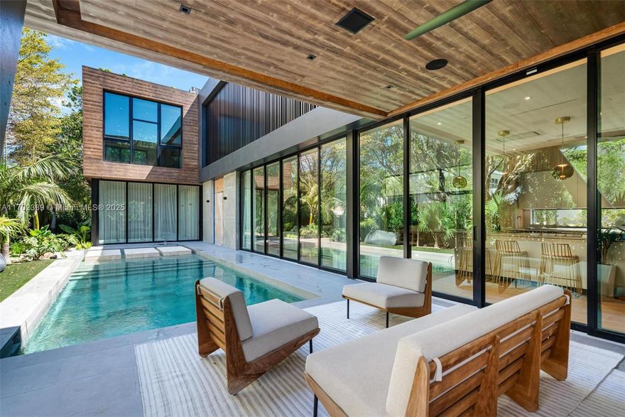 Coconut Grove's newest architectural marvel is nearing completion! This contemporary tropical oasis is situated on a corner lot with incredible proximity to Downtown Coconut Grove, top private schools, shopping, dining, & more. This residence truly blurs the line of indoor/outdoor living, with walls of sliding glass doors that bring the outdoors inside, perfect for those that love to entertain. Additional highlights for this residence include a basement with wet bar (rare for new construction in this area), lavish primary suite with dual walk-in closets & incredible spa-like bathroom, chefs kitchen with walk-in pantry, & 2 car garage. With only a few months left of construction, this one-of-a-kind estate is ready for its new owners!