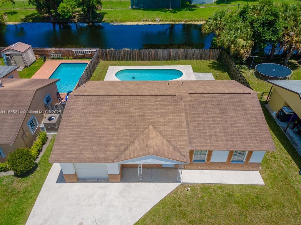 Beautifully updated 3/2 home with 1-car garage on an oversized canal-front lot with no rear neighbors. Completely renovated with beautiful finishes and a new A/C (2024). The fully fenced backyard features a pool and spacious patio—perfect for entertaining. Home also includes hurricane shutters and built-in garage cabinetry. Move-in ready with no HOA and no restrictions—making it a great investment opportunity. Currently rented month-to-month for $3,200 with tenants willing to stay; rent can be increased to current market rate. ***** Tenant Occupied. Showings start on August 19th, 2025. Must schedule appointment to show. TEXT listing agent with any questions.