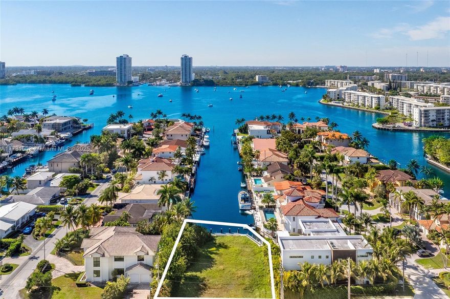Rare opportunity to own an oversized 11,400 sq. ft. vacant lot in the prestigious, guard-gated waterfront community of Eastern Shores. Available for purchase either with the adjacent home or separately, providing flexibility to expand or build your dream waterfront estate.  This prime parcel offers endless water views down the canal and breathtaking sunset vistas from your own dock. With direct ocean access and no fixed bridges, it’s a boater’s paradise. Don’t miss the chance to own your dream waterfront estate in one of NE Miami-Dade’s most sought-after neighborhoods.