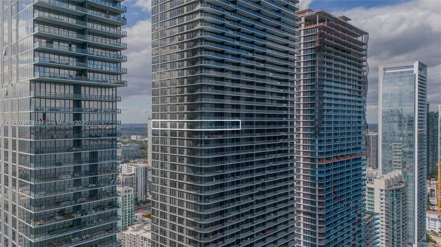 Brand-new 2025 luxury 4BR + nanny room + den, 5.5BA corner residence with 2,584 SF plus a 298 SF terrace boasting unobstructed east & west water views through floor-to-ceiling glass. Upgraded with custom closets & 2 assigned parking spaces. Enjoy 2 acres of resort-style amenities: private sports marina, 3 pools (2 waterfront), spa, fitness center, wine lounge, kids' play area, library, tennis, paddleball, basketball, mini golf & more. Prime Miami location near Design District, Midtown, Brickell & MIA Airport.