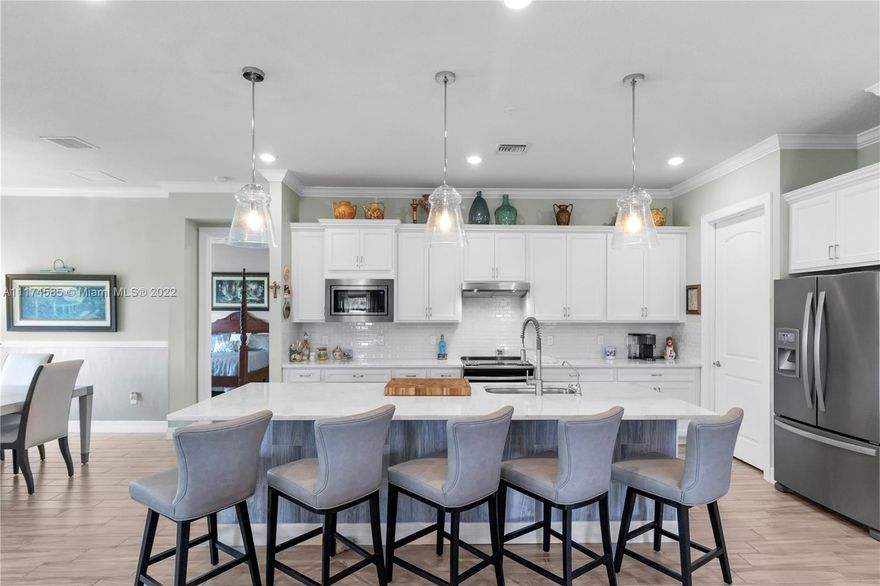 Elegance at its finest! Feels like you’re stepping into a European villa. Move in ready 3 beds & 2 ½ baths + Den. 2 car garage. Screened balcony overlooking serene lake w/fountain. The moment you enter it feels like home. Take your own elevator or stairs up to the main floor. Open concept dining & family room perfect for entertaining. Italian porcelain tile throughout, crown molding, smooth wall texture, designer wallpaper in dining room & baths. Family room has a custom-built accent wall w/ electric fireplace. Beautiful light fixtures & fans. Window treatments on all windows. Storage galore! Laundry room w/ sink & cabinetry. Condo built end of 2018. Community guard gated & has private pool. NO membership required. Updated Boca Lago CC offers social, seasonal & golf memberships. MUST SEE!