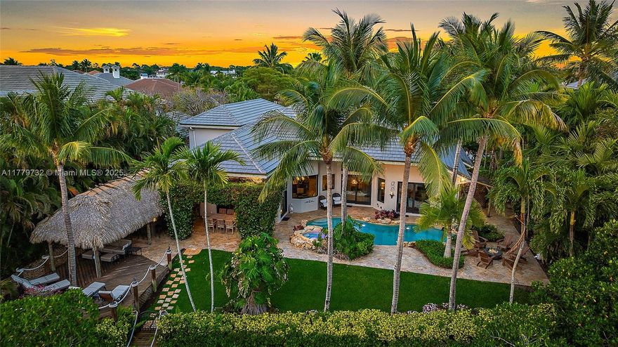 Welcome to your dream home! This beautifully updated property boasts clean lines and modern finishes throughout, creating a light and bright atmosphere that you'll love coming home to. Situated on a prime river location with ocean access, this house offers the best of the Florida Lifestyle. Backyard with Tiki Bar is ideal for entertaining, complete with a bar and fully equipped summer kitchen. Large windows and open spaces ensure plenty of natural light throughout the home. The kitchen is a chef's delight, featuring custom cabinetry, high-end appliances and elegant countertops. This is a true gem and a boaters paradise with a private dock.