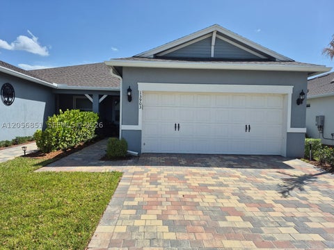 Photo of 13903 SW Gingerline Dr, Port St Lucie, FL 34987 (MLS # A12056851)