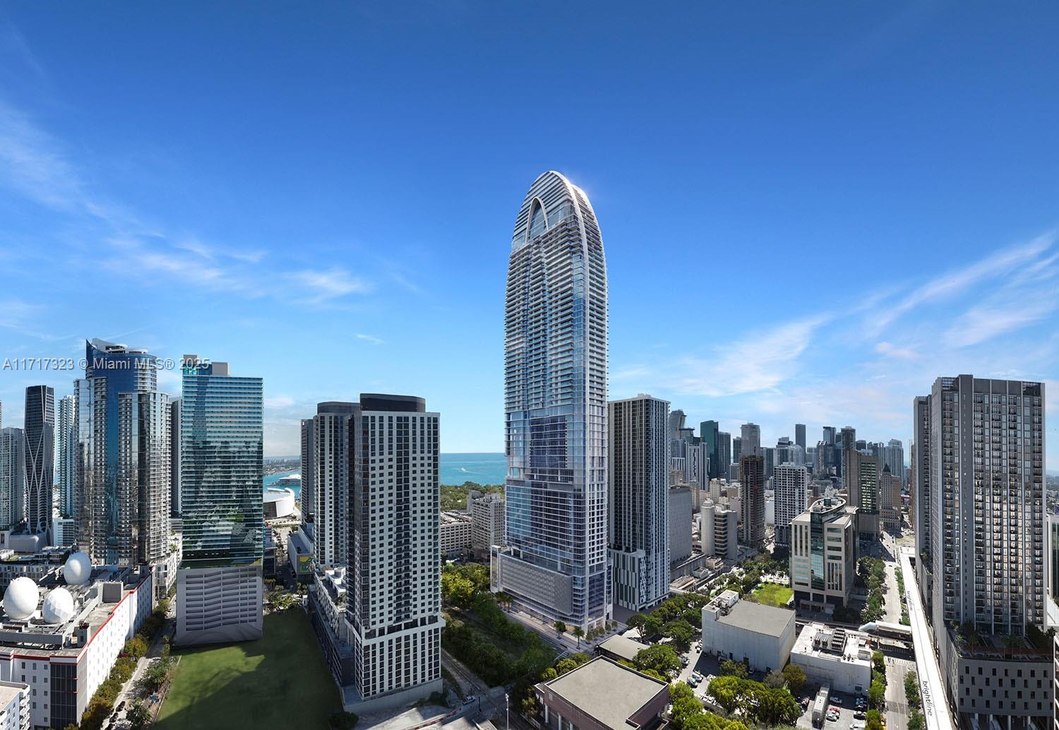Okan Tower is 902 ft, 70 stories, & located in the center of downtown Miami. Sky Residences start on the 51st Flr (600 ft+ high) & feature the most impressive unobstructed views. Residences offer high-end finishes & choice of kitchen cabinetry. Private amenities include: the highest rooftop pool in the Western Hemisphere w/ mezzanine dining & 360-degree views; in-room dining from world-class restaurants; wine lounge; 12th floor pool & club room; fitness center & spa; children's playroom; four separate high-speed elevators. A prime location with Miami Worldcenter to the north and the Historic District to the South. Daily needs within a short walk: groceries, entertainment, & parks. Transportation within 1-block: Brightline, Metrorail, & Metromover. Pricing & availability subject to change.