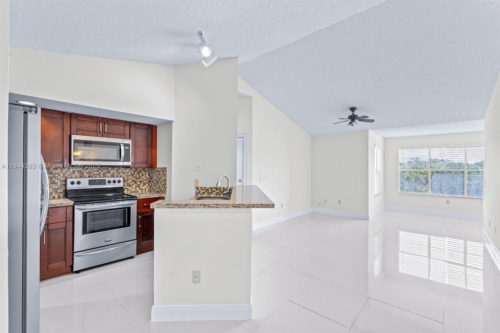 Fully upgraded condo with lake view, porcelain tile floors, and washer & dryer inside the unit. Freshly painted, with wooden kitchen cabinets, top-of-the-line stainless steel appliances, and a spacious walk-in closet. This unit is far superior to others for sale in the community thanks to its high-end upgrades—offering greater comfort, style, and long-term value. Located in a resort-style gated community with 2 heated pools, hot tub/sauna, tennis courts, clubhouse, BBQ area, and gym. Assigned & guest parking. Easy association, rent right after closing, all ages welcome. Prime location near Tanger Outlets, CityPlace, I-95, parks, golf, Palm Beach Airport, and just minutes from the beach.