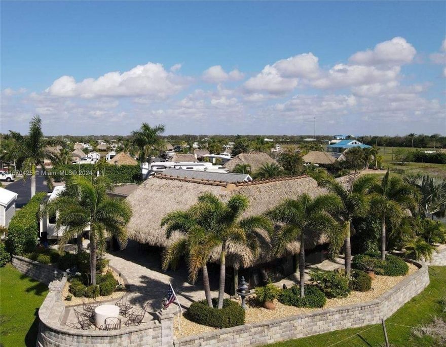 5 START RV RESORT - GATED COMMUNITY - Beautifully landscaped with pavers, sprinkler system, well, Casita completely finished inside with kitchen, bathroom, washer-dryer, central air, refrigerator, sofa bed. The Tiki has an outdoor kitchen complete with everything you need. A/C is one year old, roof on Tiki is one year old, there is mosquito screens on the Tiki, two (2) TV's and the one TV you can adjust up or down, three fans, the Tiki is 1200 sq ft, Casita is 12 x 14 completely furnished with two TV screens. This is one of the largest lots in resort and it is on the reserve. There is so much wildlife to watch. While there saw two Otters. You are close to the Clubhouse, pool, Tiki Bar, and all activities.