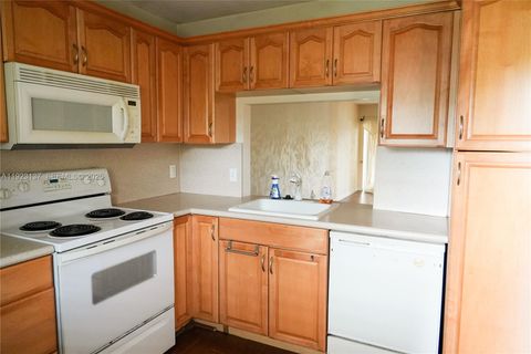 Photo of 3905 N Nob Hill Rd #103, Sunrise, FL 33351 (MLS # A11923137)