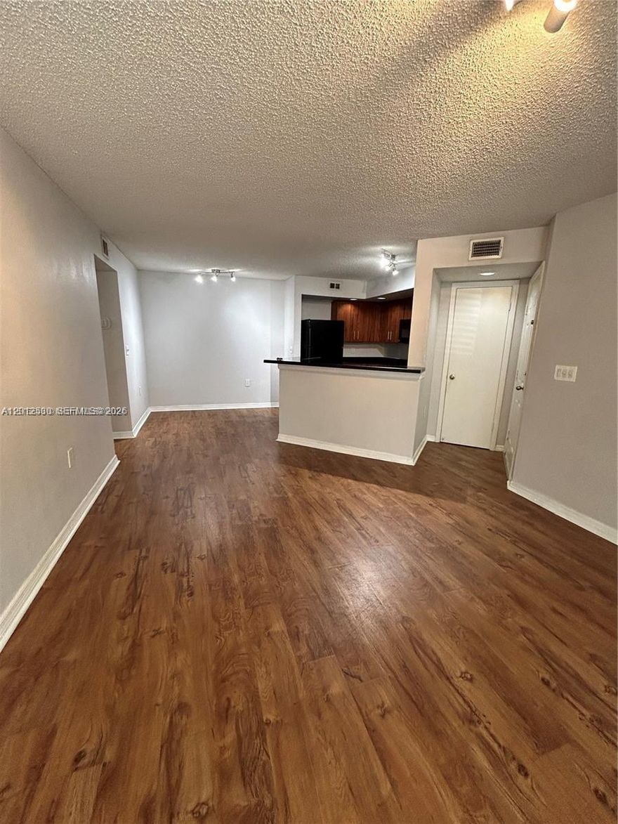 This beautiful and updated 2-bedroom, 1-bathroom condo is located on the first floor of a highly sought-after community, offering wood floors throughout, a modern open-concept kitchen, and the convenience of an in-unit washer and dryer. The unit has been updated , making it a move-in-ready opportunity you don’t want to miss! The community boasts resort-style amenities, including a swimming pool, tennis courts, a fully equipped gym, and an elegant clubhouse, along with plenty of parking for residents and guests. Situated in a prime location on Flamingo Road, this condo offers quick access to I-595 and is just minutes away from Publix, Sawgrass Mall, restaurants, and top-rated schools. This unit is easy to show with lockbox access—schedule your visit today before it’s gone!