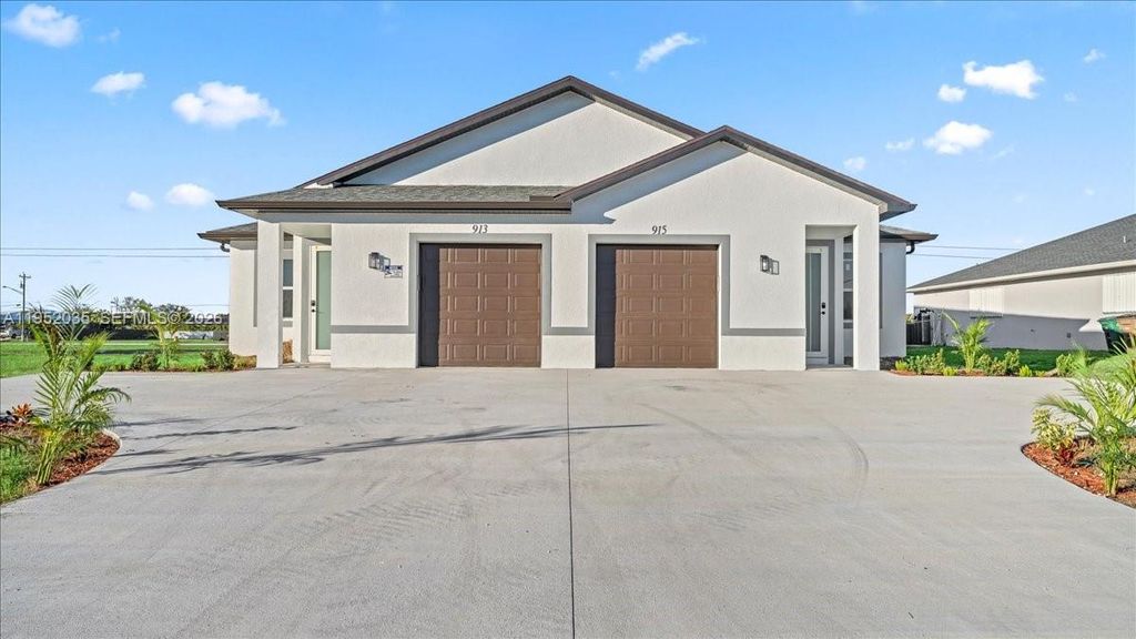 Photo of 913/915 NE 15th Ln, Cape Coral, FL 33909 (MLS # A11952035)