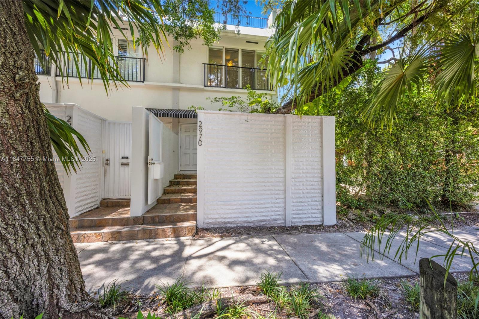 Walk, bike, or scooter to everything from this ideally located Coconut Grove townhome in the lushly landscaped Peppertree Village. One of only 11 residences, each townhome features a private courtyard entry, two bedrooms, two and a half bathrooms, a one-car garage, two additional parking spaces, and a rooftop terrace. This tri-level unit offers a spacious layout with terracotta and bamboo floors, a dining room with a terrace, and a kitchen with stainless steel appliances. The gated community is just steps from Cocowalk, parks, marinas, coffee shops, and some of the Grove’s best restaurants. Located in the Coconut Grove Elementary school district, with other top public and private schools nearby. Easy to view and ready for its next residents.