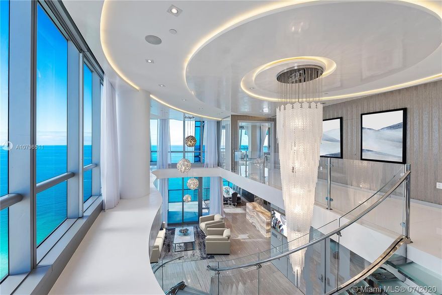 The Crown Jewel of Jade Ocean! This Corner PH has that Extra WOW Factor with a Prime Architectural & Interior Design Experience that completely transformed its 7900 SF of interior + exterior space. Residence features double height ceilings across 3 living areas, Onyx-clad bar, 5 terraces offering views of the Ocean & City, Master Suite w/ his/her bathrooms w/Bisazza mosaic tile & his/hers walk-in closets, 4 guest suites, 6.5 bathrooms, Crestron technology, 2 storage units & 3 VIP assigned parking spaces. Jade Ocean offers fully staffed amenities such as beach service, cafe, sunrise & sunset pools, wellness & fitness center, kid’s playroom, business center & in-home touch screen that allows residents to request concierge, valet, dining & spa services.