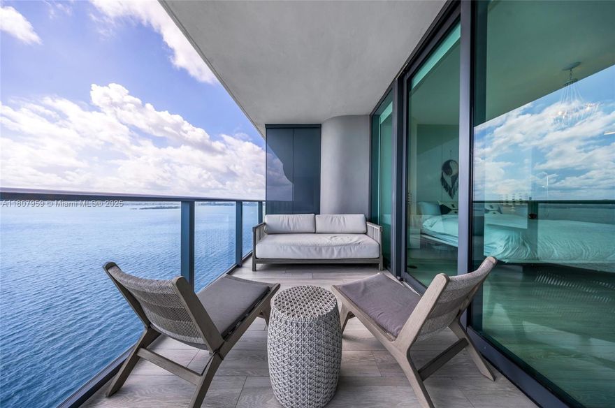 BEAUTIFUL 2-bedroom, 2-bathroom unit at One Paraiso. Unit has amazing views of the bay and intracoastal. modern kitchen with top-of-the-line appliances. The guest room has a king-size Murphy bed. The amenities are amazing --tennis courts, multiple pools, private elevators, a movie theater, spa, gym, activity rooms, and concierge. Plus, there are 1 parking spot with valet available. Residents also get access to a private boat dock.