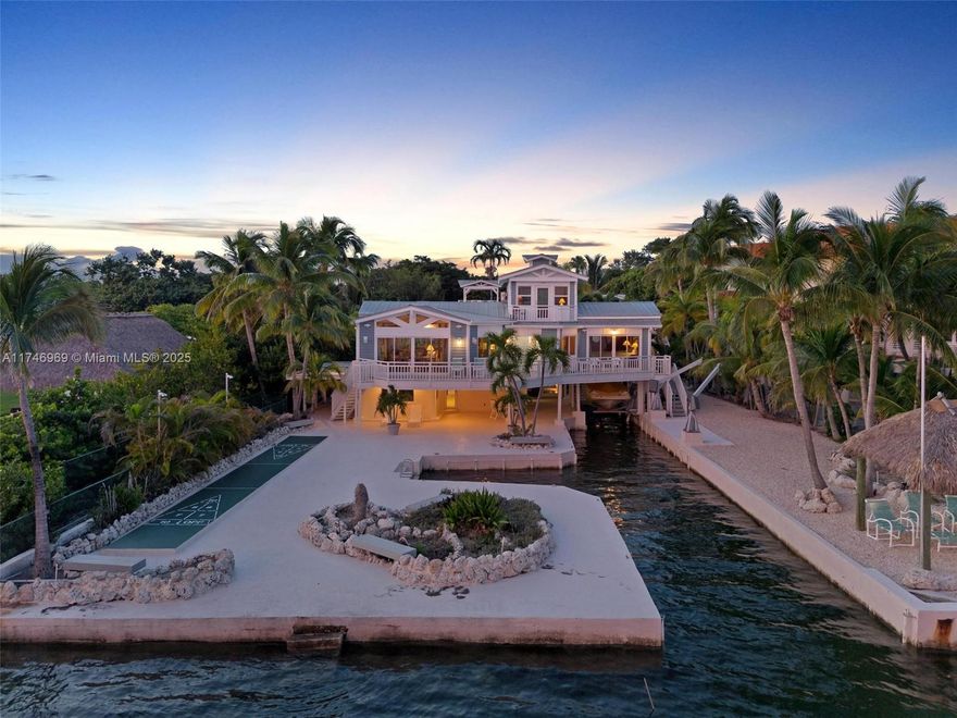 SELLER FINANCING AVAILABLE!!! Paradise awaits at this stunning 7-bed, 6-bath waterfront estate in Summerland Key! Designed for luxury, privacy & adventure, this resort-style retreat boasts breathtaking open-water views, a private boat basin, and high-end amenities—just moments from exclusive Little Palm Island. Spanning 4,531 sq ft, (Spanning 4,531 sq ft, (12,603 sq ft gross)  the main house features soaring cedar ceilings, ocean views & seamless indoor-outdoor living. A private suite, two guest bedrooms, two cottages & a widow’s peak lounge offer space for all. Enjoy a 3-tier heated/cooled pool, boat lift, tiki hut, shuffleboard & more. Upgraded with impact windows & mini-splits, this is ultimate Keys living. Schedule your tour! Monthly rental—do not walk property. (See Supplement)