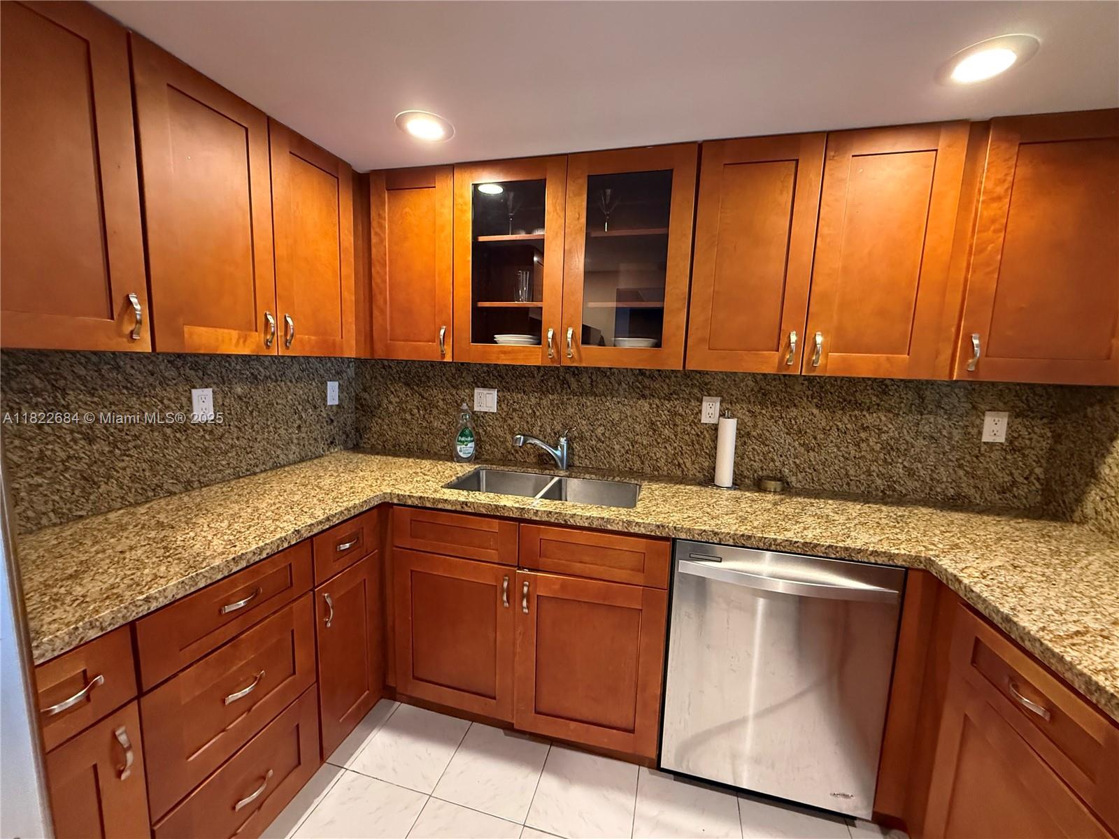 This spacious, partially furnished 1BR + den unit offers 915 sq ft of bright, clean living space with new impact resistant windows. The modern kitchen granite counters, while tile floors run throughout. Enjoy tranquil view, including partial lake view from your private balcony.
The community includes pool, tennis courts, fitness center, BBQ area, and secure entry. Excellent location—just minutes from the beach, shops, I-95, and more! Move in immediately and start enjoying South Florida living at its finest.