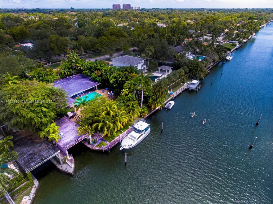 Here is your chance to own a home with a great address, on the most prestigious, elegant and sought after waterway in Coral Gables.  This 5-bedroom, 3.5-bath pool home on the wide Coral Gables waterway, is overflowing with potential, with a large ‘Dock House’ or boat house and a large dock.  The home sits on approximately 13 ft. elevations on natural coral rock and provides the best hurricane safe harbor you’ll find in miami for your boat. This is an estate sale, and it’s on the market for the first time in decades.  It has a great floor plan and is ready for your unlimited updates.  This is your chance to live the most amazing South Florida lifestyle and settle into what you can easily turn into your forever home!