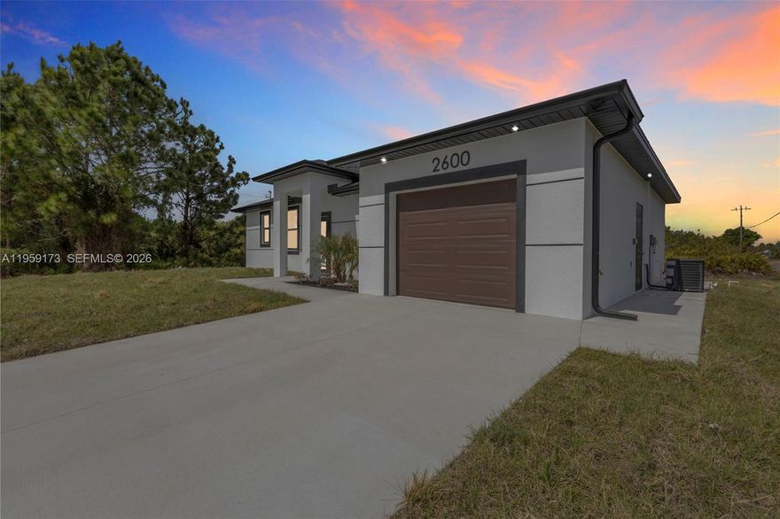 Seller is motivated and ready to make a deal! 10 Year Structural Warranty and 3% seller credit toward buyer’s closing costs with full-price offer. Local, experienced builder with outstanding customer support. 100% completed and ready to move-in. Be sure to click on the 3D virtual tour! This beautifully designed new construction home sits on a corner lot and offers a modern living space. Featuring 3 bedrooms, 2 bathrooms, and a 1-car garage, the home includes 10-ft ceilings, hurricane-impact windows and doors, and washer/dryer installed in a separate laundry room. Enjoy 32x32 porcelain tile flooring throughout, high-profile baseboards, and a spacious kitchen with custom cabinetry, quartz countertops, and a full suite of Samsung stainless-steel appliances. Bathrooms showcase quartz finishes, glass shower doors, and premium fixtures. The property also includes a full irrigation system. Surrounded by new homes in the desirable 33976 zip code, this residence combines style, quality, and value. Don’t miss your chance!