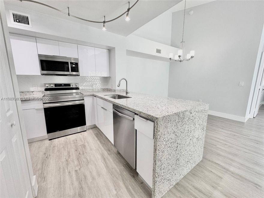 ONE CAR GARAGE INCLUDED - Beautiful Remodeled 1065 sqft 2 bedrooms 2 baths Corner unit Condo in the heart of Pembroke Pines. Property features: Beautiful open Concept Brand Kitchen with New Wood Cabinets, Granite Counter Tops with water fall concept, New Backsplash and New stainless-steel appliances, Spacious bedrooms w/ walk-in closets, beautiful bathrooms with modern Vanities, New Vinyl Floors & Baseboards throughout all Place. Open balcony to enjoy & relax in your free time, Washer & Dryer inside unit. Condo has been recently painted, ********* A MUST SEE************** Located just steps to Pembroke Pines Mall and Pines Blvd., easy access to major expressways, restaurants, supermarkets and great school district. Send your best offer now!