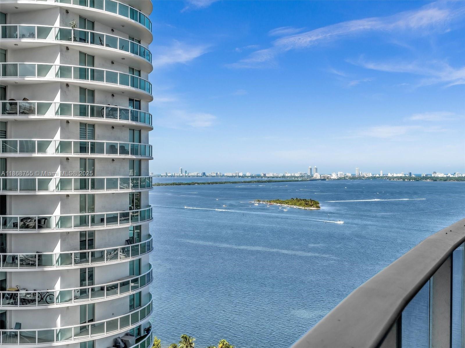 Live the high-rise Miami dream at Aria on the Bay. This 23rd-floor 2 bed plus den, 3 bath unit offers stunning views of Biscayne Bay and the city skyline from a large balcony that spans the entire unit. Both bedrooms function as primary-style suites with ensuite baths and walk-in closets. Private elevator entry with foyer, floor-to-ceiling windows, and open layout. Den can serve as a third bedroom or office if desired. Kitchen features Bosch appliances, quartz counters, and European cabinetry. Walk to Margaret Pace Park and bayfront trails. Amenities include two pools with sun/shade all day, hot tub, gym, yoga room, spa, theater, BBQ area, kids’ playroom, and 24-hour concierge. Exceptional value in Edgewater. Available Immediately!