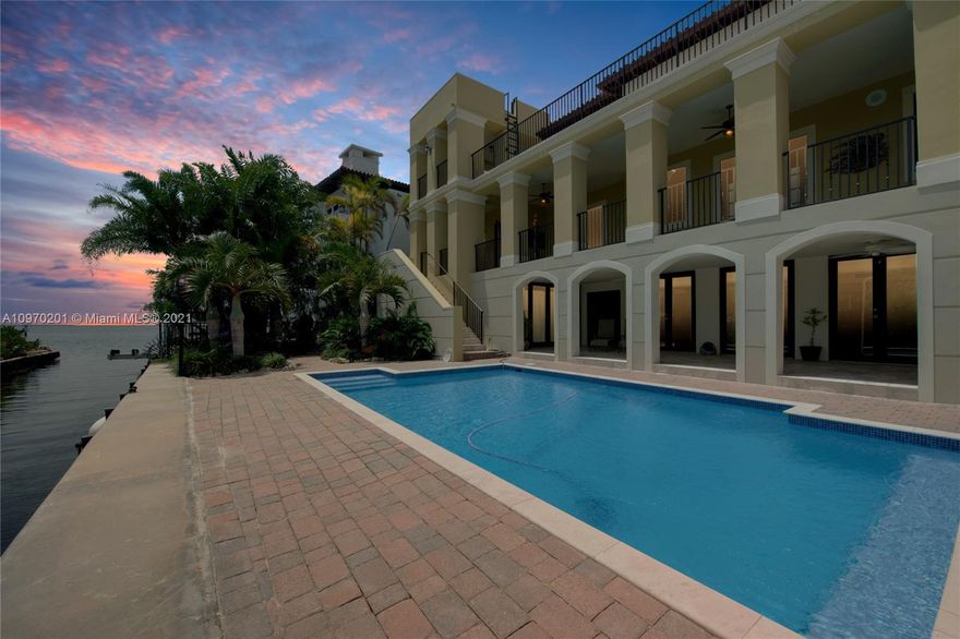 Stunning and impressive one of a kind property in the heart of Coconut Grove.  Nestled at the private end of Poinciana Avenue, within the guard-gated prestigious Four Way Lodge Estates. Breathtaking views of downtown Miami and Biscayne Bay. Spectacular oversized terraces run along all three levels and can be accessed from almost every room. Property is complete with gourmet chef's kitchen/butler's pantry, elevator, multiple living areas, fireplace, three car garage, impact windows, heated salt water system pool, boat davits, and so much more. Impressive master suite with his/hers bathrooms and closets. All bedrooms are en suite. Over 1000 square feet of enclosed a/c bonus recreation/reception space. The perfect home for entertaining. One house from the bay. Must see to appreciate.