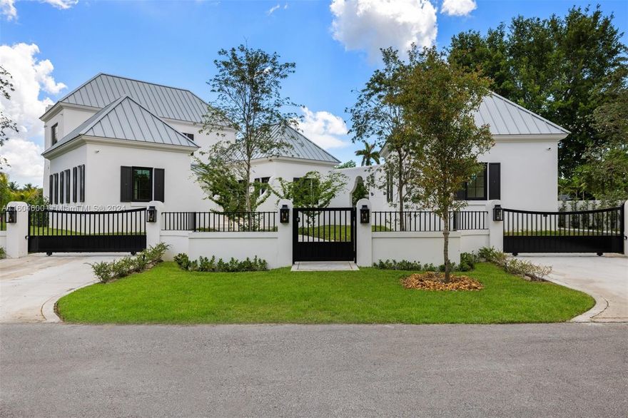 Immerse yourself in South Miami living in this brand-new construction, custom-built home. This 3 BD, 3.5 BA, 4,181 sq ft residence boasts unique Mediterranean styled details and contemporary architectural design features. Includes a chef's dream kitchen with high-end finishes, and a sparkling heated pool – perfect for year-round enjoyment. Meticulously crafted with an open floor plan, the home allows for effortless entertaining and indoor-outdoor living. The second floor is entirely dedicated to the primary suite with its spacious terrace overlooking the pool and lake. Unwind in the private backyard with open lake views and calming breezes, creating an ideal space for family gatherings and unforgettable moments. Don't miss this opportunity! This one-of-a-kind property won't last long.