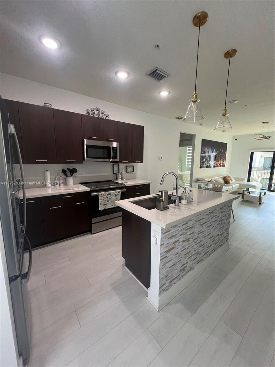 Elegant 3-bed, 2-bath condo in the heart of Doral, offering luxurious, resort-style living in a family-friendly community just steps from Downtown Doral.
Walk to top-rated schools, parks, restaurants, and all the entertainment Downtown Doral has to offer — all in a safe, family-oriented neighborhood.
Designed with style and comfort in mind, this home features sleek Italian-style kitchen cabinetry, elegant quartz countertops, and top-of-the-line stainless steel appliances — perfect for modern family living.
Enjoy resort-style amenities including a stunning clubhouse, resort pool with sun deck and cabanas, fully equipped fitness center, indoor basketball court, running track, business center, and a water park designed for kids — all just steps from your door.