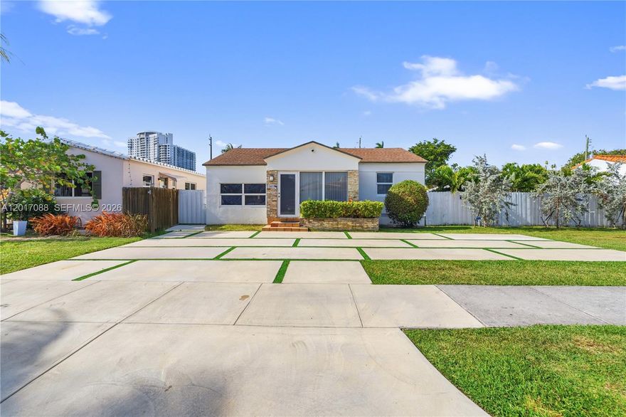 Experience luxury living in this stunning 3-bedroom, 3-bath single-family pool home, ideally situated just minutes from vibrant downtown Hollywood, the scenic boardwalk, and pristine beaches. The main residence features three spacious bedrooms and three beautifully updated bathrooms, while a separate, fully remodeled cottage provides an additional bedroom, bath, and kitchenette—ideal for guests or extended family. Elegant ceramic tile floors flow throughout, complemented by a contemporary kitchen boasting white cabinetry, quartz countertops, a designer backsplash, and stainless-steel appliances. Updated bathrooms include one that conveniently serves as a cabana bath, opening directly to a lush, fenced backyard. Enjoy resort-style living with a modern pool and a fully equipped outdoor kitchen, perfect for entertaining or relaxing in your private paradise.