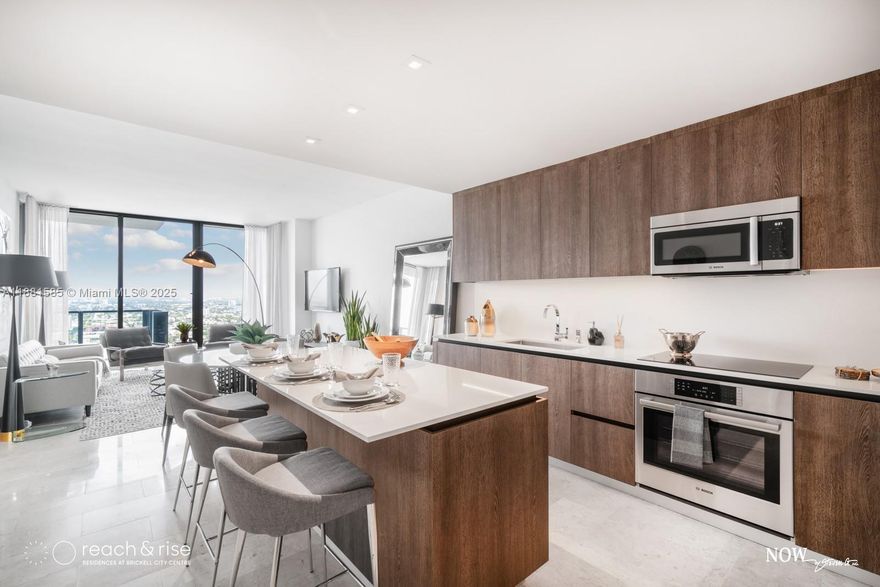 Rise at Brickell City Centre is a 43-story luxury tower located in the heart of Brickell with direct access to Brickell City Centre mall. Brand new, fully furnished residence featuring an open layout with floor-to-ceiling windows, electric blinds/blackouts, Italkraft kitchen cabinetry, Bosch stainless steel appliances, marble floors throughout, and an extended balcony with panoramic city views. Building amenities include a 1-acre amenity deck, indoor/outdoor fitness center, resort-style pool with pool service, BBQ grills, pergola, hammam spa, children’s playroom, party room, business center, 24-hour concierge, and valet. Rent includes cable, internet, water, one assigned parking space, and four complimentary guest valet passes per day.