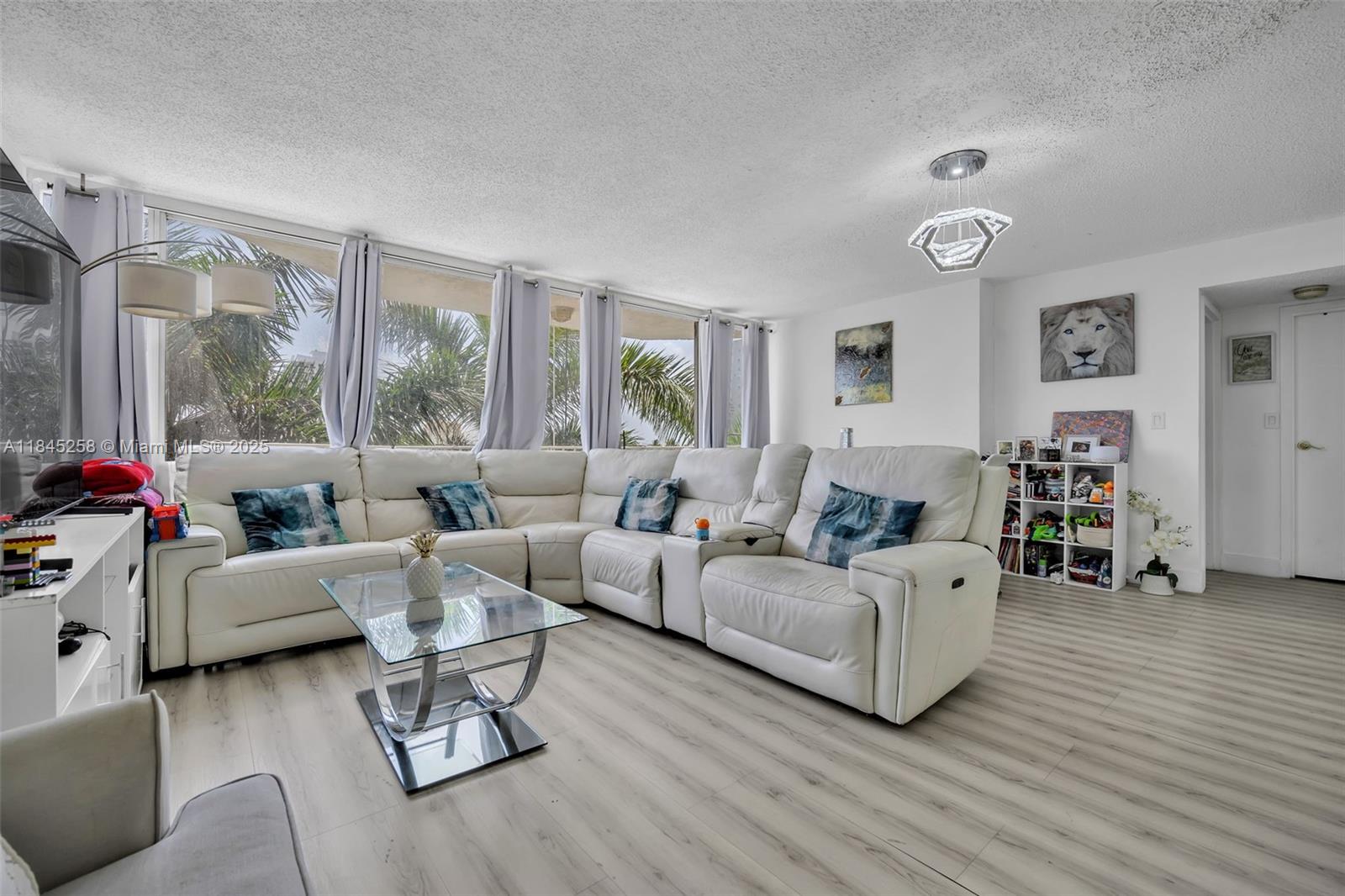 Waterfront luxury living in prestigious North Bay Village! This beautifully designed 3-bedrooms, 2-bathrooms residence features an amazing layout with partial water views and an extensive balcony perfect for entertaining. Located steps from a full-service marina, residents enjoy direct access to boating and water activities. The building offers trendy cafes and boutique shops on the lower level, creating a vibrant lifestyle right at your doorstep. This prime location combines the tranquility of waterfront living with the convenience of urban amenities. Experience the perfect blend of relaxation and sophistication in one of Miami-Dade's most sought-after communities. Don't miss this exceptional opportunity to embrace the coastal lifestyle.