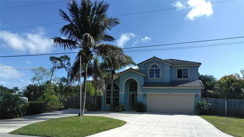 Photo of 170 NE Dominican Ter, Port St Lucie, FL 34983 (MLS # A11836616)