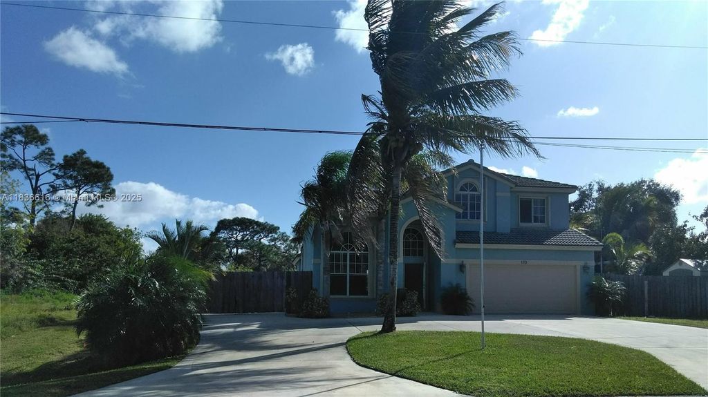 Photo of 170 NE Dominican Ter, Port St Lucie, FL 34983 (MLS # A11836616)