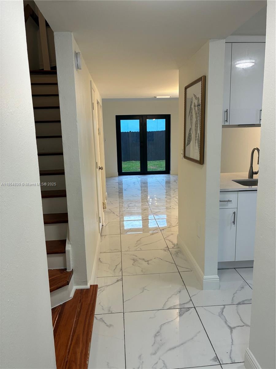 NEWLY renovated 2 story townhome. This is one of only four units in the building allowing for a peaceful and quiet home. Features include a very large and private backyard, washer/dryer in unit, 2 assigned parking spaces, quartz countertops, new appliances, and impact windows and doors. Rent includes lawn maintenance. Tenant pays electricity and water. Very easy to show!
