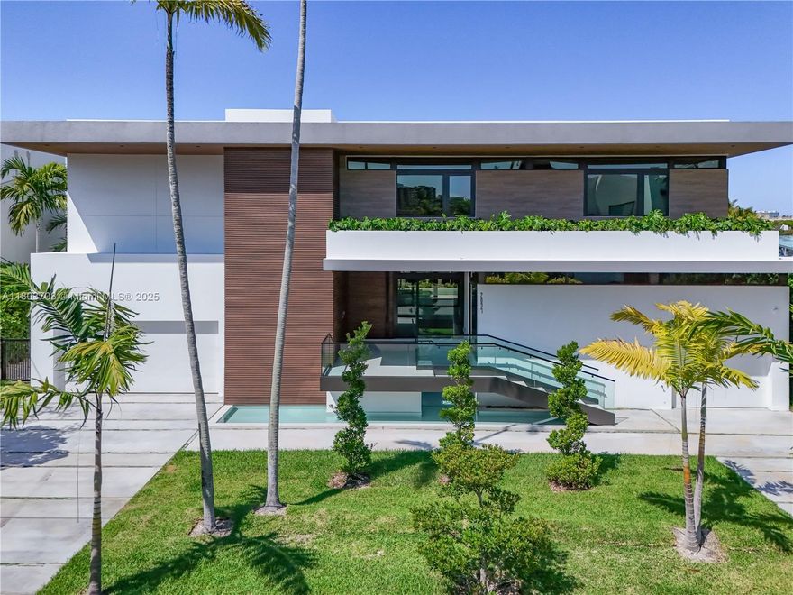 NEW CONSTRUCTION with rare to find 100 ft on direct ocean access no Bridges to Biscayne Bay. Ocean access in 15 minutes. This 2 story pool home features 8,036 total SF, with 7 bedrooms and 8 1/2 baths plus 4 car garage. Soaring ceilings and open concept contemporary design. Outdoor summer kitchen overlooks 40'ft pool and spa. Elevator and water features plus 2 master suites, one upstairs and one downstairs. All concrete construction and concrete roof! 12,500 SF of land. Located in Sans Souci Estates, 1 24 HR police gated community in Miami, FL.