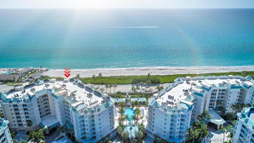 Stunning Oceanfront Condo. This completely renovated contemporary condo offers beautiful ocean views from the living, kitchen, master & guest rooms. The sleek kitchen remodel includes white shaker cabinets, Kitchen-Aid appliances and gorgeous river white granite countertops. Real wood & neutral tile floors. Magnificent light shines through impact glass windows and sliders. Remote Hunter Douglas shades open to a huge 40' entertaining Balcony. The den is being used as a 3rd Bedroom. Jupiter Ocean Grande is r