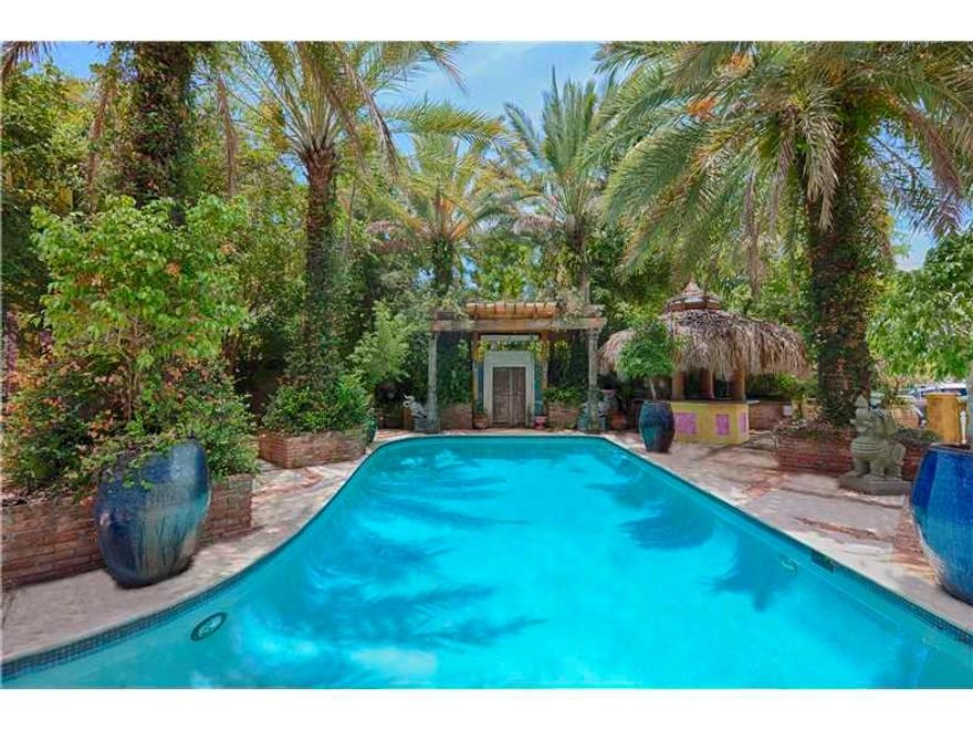 This 2-story, 6 BR/5+1 BA estate rests on expansive lot w/interior courtyard & fountain & oversized heated pool overlooking the Intracoastal. Marble and wooden floors throughout, priv dining room, open living room w/fireplace, chef's kitchen w/new applian ces & large family/media room. 2nd floor master w/custom his/hers closet spaces, walk-out access to a private sun deck overlooking pool. Exterior highlights include open sitting areas, tiki bar, lush gardens, electric lift for boat or jetskis, outdoor BBQ