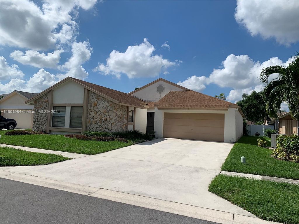 Photo of 20963 Rustlewood Ave, Boca Raton, FL 33428 (MLS # A11601984)