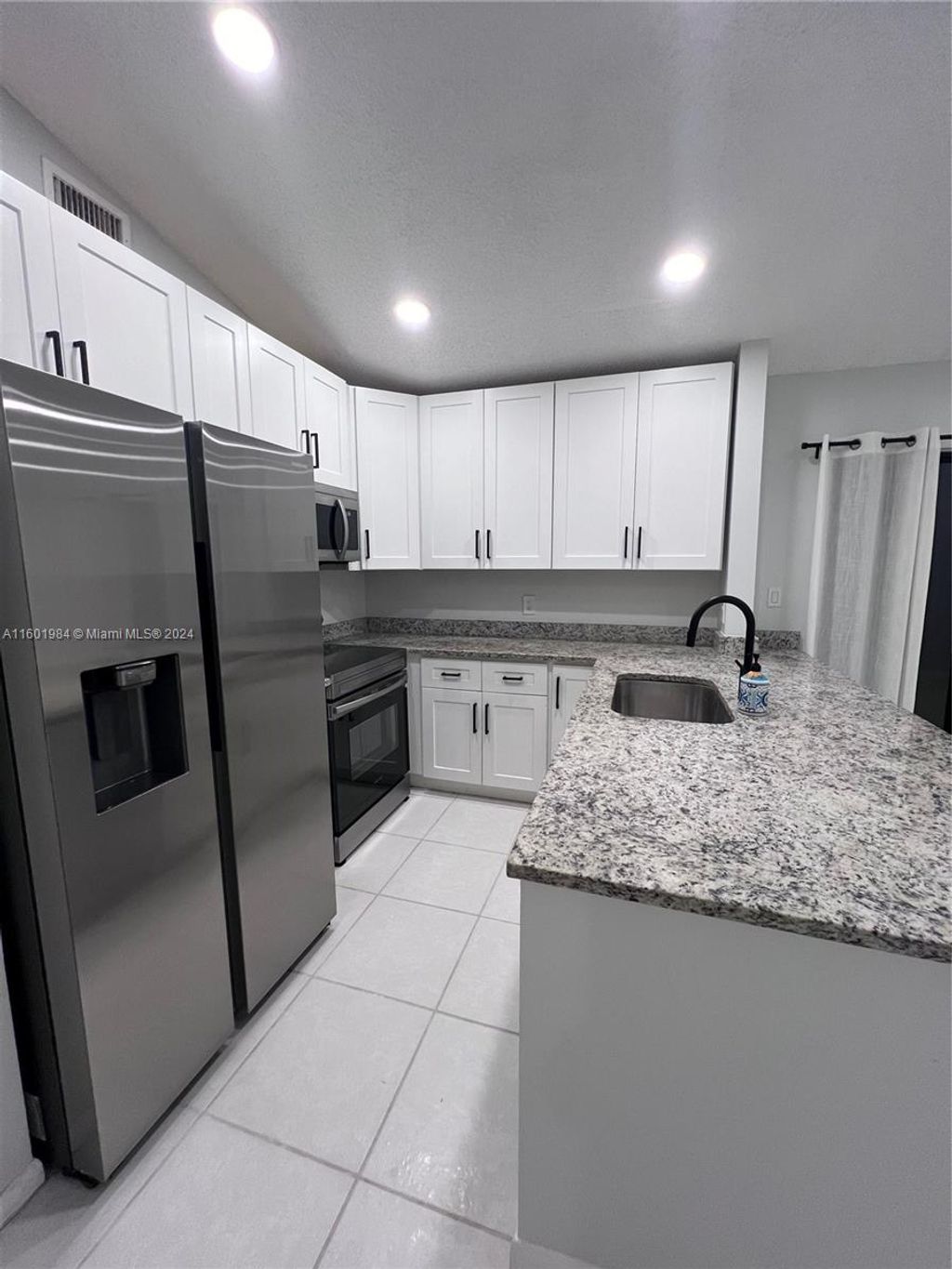 Photo of 20963 Rustlewood Ave, Boca Raton, FL 33428 (MLS # A11601984)