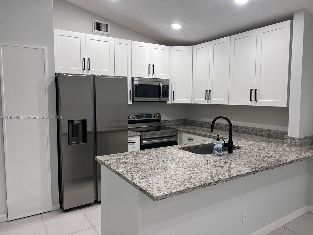 Photo of 20963 Rustlewood Ave, Boca Raton, FL 33428 (MLS # A11601984)