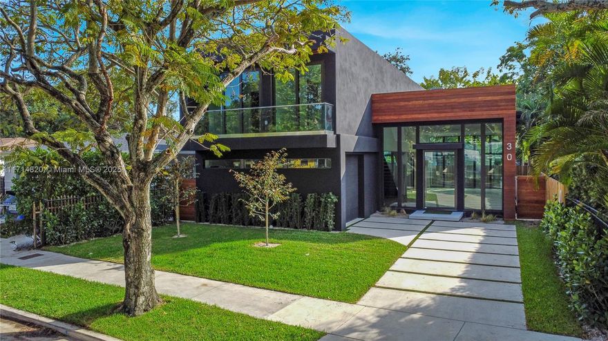 A few blocks from The Miami Design District sits this new construction modern home with 3,642 total SQ/FT. 4 bed/5 bath + den that can be used as a 5th bedroom. Walk through the oversized pivot door and find an open floor plan with 13' ceilings. The tall windows overlook the pool and seamlessly integrate the indoor & outdoor spaces for the ultimate Florida lifestyle. Oak wood flooring, Hansgrohe/Grohe fixtures, impact resistant windows/doors, floor to ceiling kitchen cabinets & Sub Zero/Wolf appliances are just some of the upgrades. Custom closets built out in every room. Heated pool W/salt water chlorinator. Outdoor kitchen W/BBQ, fridge & countertop under covered terrace. 1.5 car garage. Not in a Flood zone. Built over 14' above sea level. Wynwood and the Beaches are a short drive away.