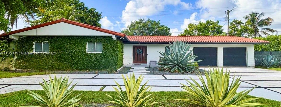 Beautifully maintained and tucked away on a low traffic street of the highly desirable community of Kendallwood. A move-in ready home on a wide canal featuring 3 bed, 2 bath, 2 car garage, impact windows/doors & modern open floor plan w/ mature landscaping thruout. A sleek & updated kitchen w/ quartz counters & stainless steel appliances open up to your outdoor oasis- complete with a covered patio, built-in BBQ, wood-paneled ceiling and an outdoor dining area. Perfect for entertaining! Fully fenced yard with mature hedges for privacy. Additional features include a spacious master bathroom, walk-in closets in two bedrooms, naturally bright throughout. A rare blend of style and comfort. Centrally located just a half mile from Baptist Hospital and Dadeland Mall & main highways.