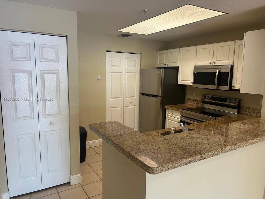 Photo of 2809 Amalei Dr #102, Palm Beach Gardens, FL 33410 (MLS # A11859258)