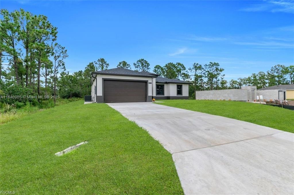 Welcome to an exceptional new construction residence in the heart of Lehigh Acres, where contemporary luxury meets thoughtful design. This impeccably crafted home presents an enticing blend of sophistication and practical living spaces, offering 4 bedrooms and two well-appointed bathrooms. Step through the elegant double-door entry into a home that exemplifies modern Florida living. ---------> Refer to Supplemental Remarks for full description!!