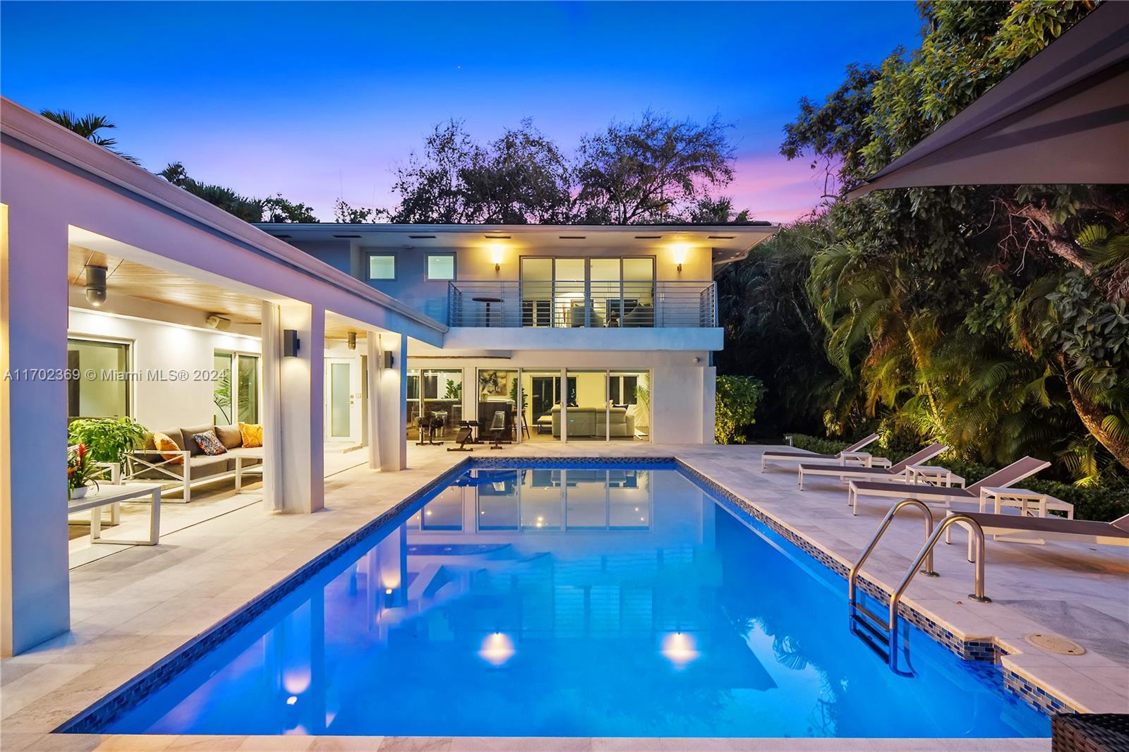 Nestled in the exclusive Bay Point Estates, this modern contemporary home is located at the end of a quiet cul-de-sac on a sprawling 16,988 sq ft lot with lush landscaping. The property features a heated saltwater pool, Calcutta deck with a BBQ area, and abundant greenery at the NW end, while the SW boasts a 5,000 sq ft Zen Garden with a koi pond and brick path surrounded by Canopy trees. Inside, the home offers a luxurious master suite with a private balcony, 4 bedrooms, 3 bathrooms, an entertainment room, second living area, chef’s kitchen with gas island, high-end finishes, new AC, gas generator, and a 2-car garage. Located minutes from Miami’s best shopping, dining, and schools.