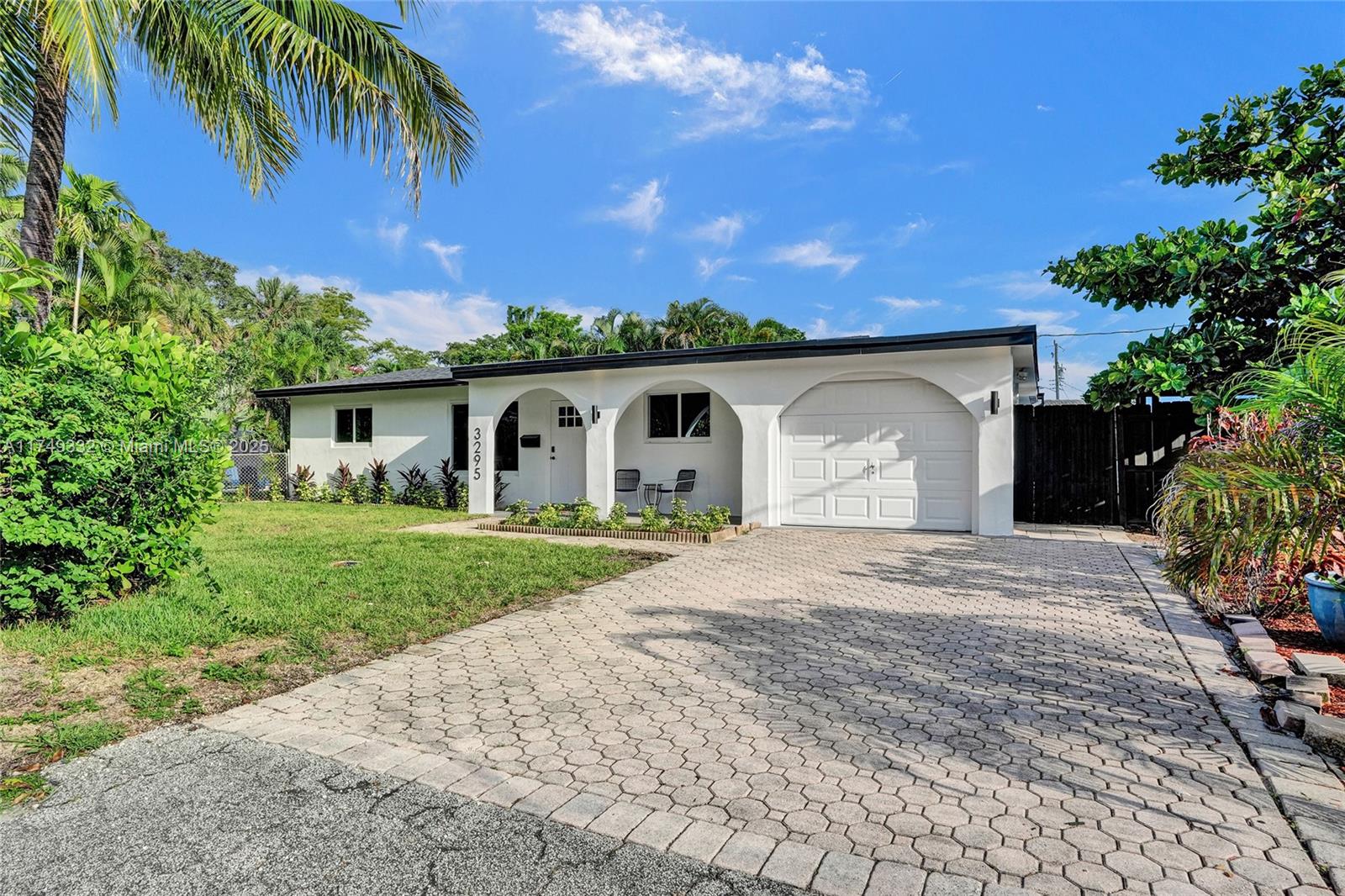 Welcome to Paradise! Stunning 3-bed, 2-bath home with an open kitchen, spacious family room, and sliding glass doors overlooking the sparkling pool. Features impact windows, a brand-new roof, and an expansive laundry room. The exceptionally large backyard boasts two patios and a private Pickleball Court—perfect for entertaining! Located at the end of a quiet cul-de-sac, just 10 minutes from Las Olas Beach, dining, and shopping. Fully furnished option available—move-in ready! Perfect for short term rental or vacation home.