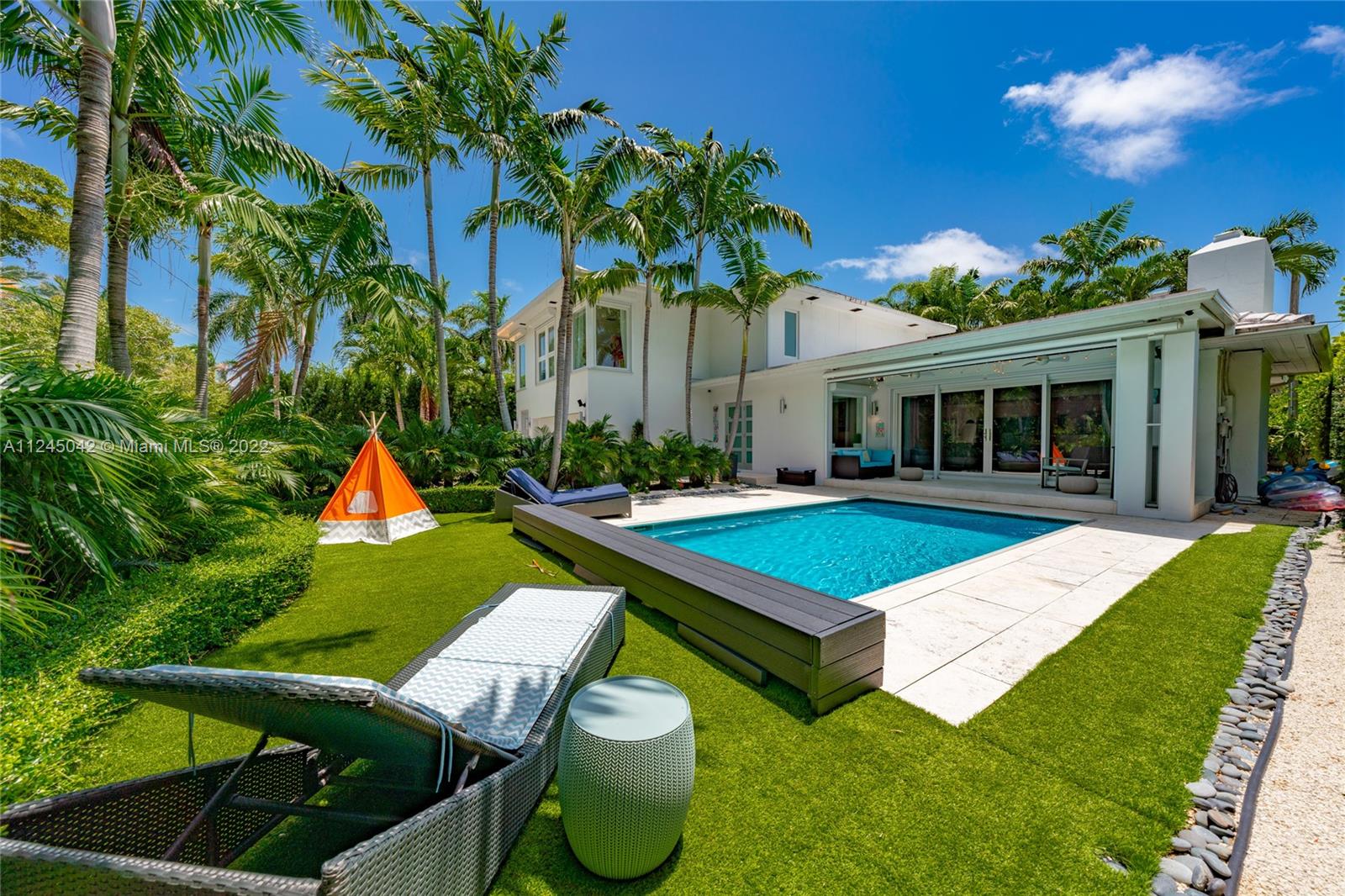 Located on prestigious N Bay Road, this impeccable residence features 5beds 4.5baths plus nanny’s quarters and offers an array of high quality modern finishes throughout. With over 3,400/SF, this well designed floor plan is ideal for entertaining. The home was completely renovated and features a new 598/SF addition creating 2bd/1bth on the 2nd floor adjacent to the main bed. The 1st floor consists of 2bds 2.5bth, a custom kitchen with marble counters, Gagganaeu appliances and induction cooktop. Custom baths, white oak floors throughout, heated salt water pool, impact windows, electric awning and optional screened patio, security cameras and secured gated driveway. Surrounded by lush tropical gardens, this private oasis exudes quintessential Miami Beach living. Please see virtual tour.
