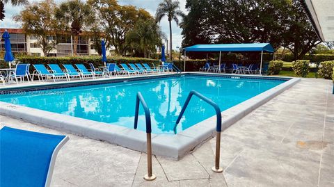 Photo of 671 S Hollybrook Dr #104, Pembroke Pines, FL 33025 (MLS # A11988389)