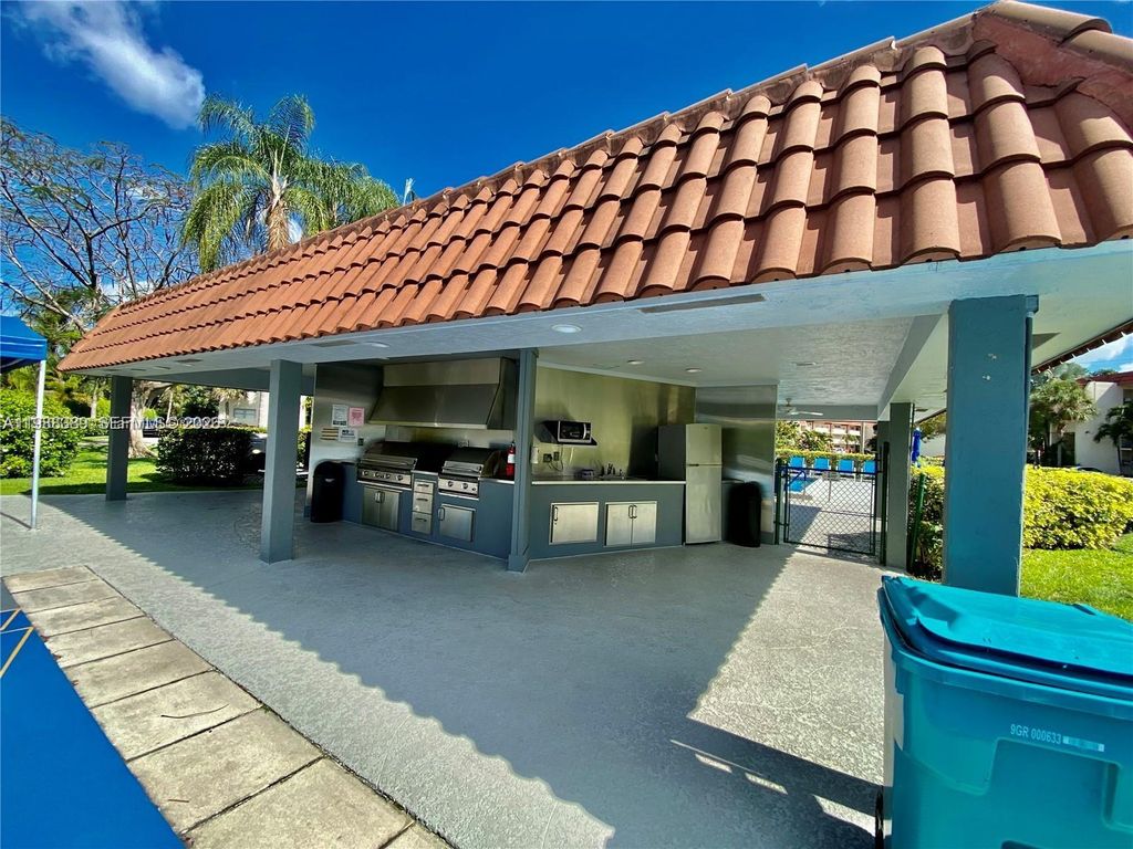 Photo of 671 S Hollybrook Dr #104, Pembroke Pines, FL 33025 (MLS # A11988389)